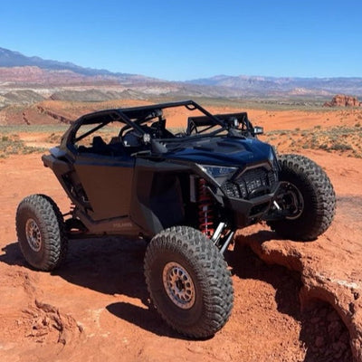 voodoo turbo r 2 seat roll cage installed on a balck polaris turbo r