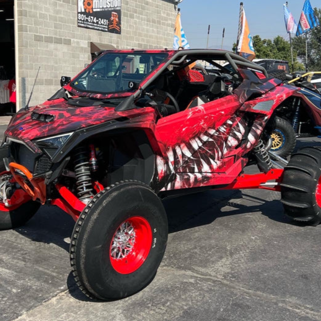 polaris pro r two seat rollcage from voodoo rr installed on red and black polaris pro r