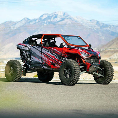 voodoo turbo r roll cage installed on a red and grey polaris turbo r 4 seater